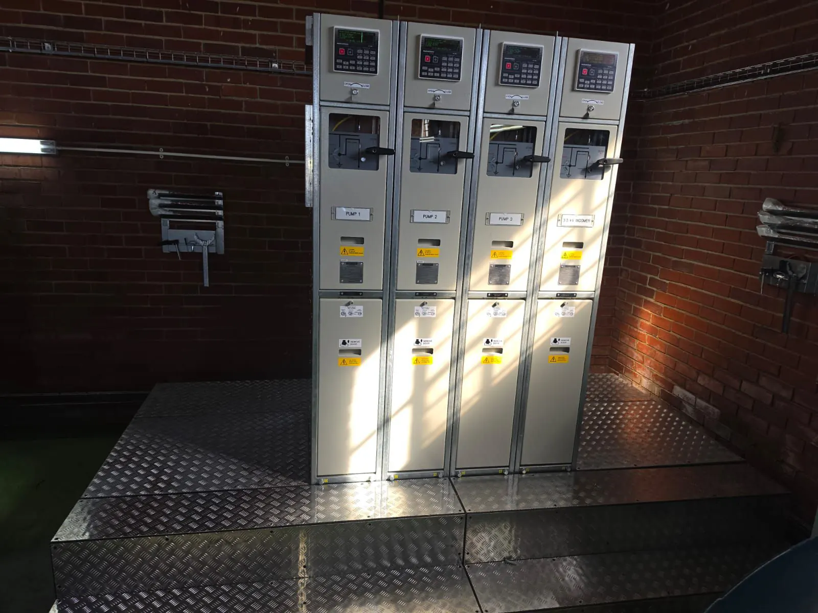 Medium-voltage switchgear panels installed on site by AM Power Solutions, labelled Pump 1, Pump 2, Pump 3 and 3.3kV Incomer