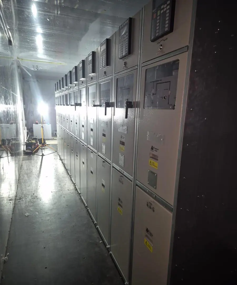 Row of SGF/MVT medium-voltage switchgear bays installed at a client site, protective wrapping still in place